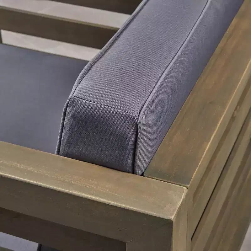 Fauteuil de jardin GDFStudio Cascada en bois d'acacia avec coussin résistant à l'eau