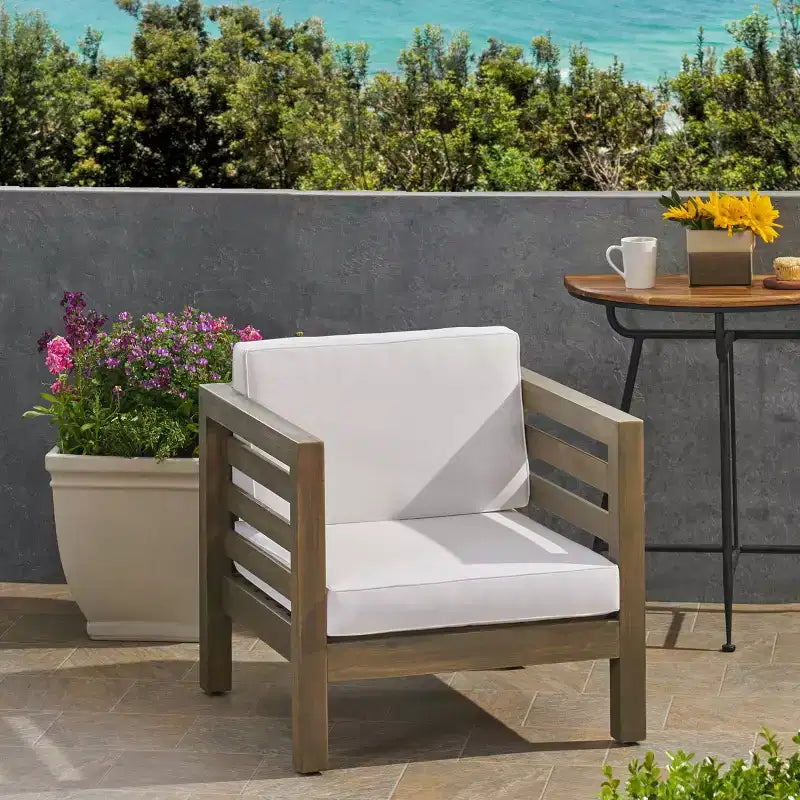 Fauteuil de jardin GDFStudio Cascada en bois d'acacia avec coussin résistant à l'eau