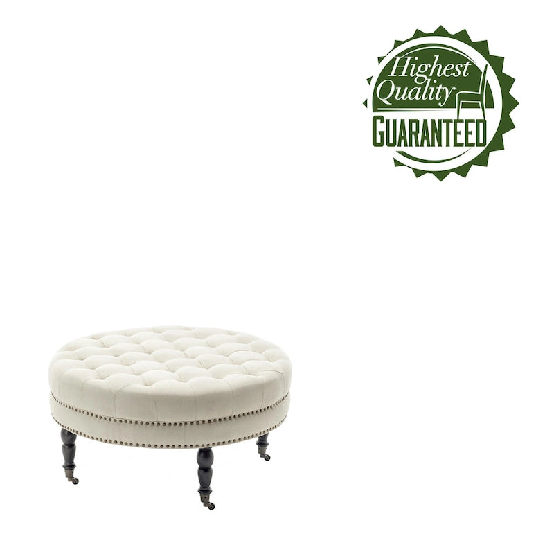 Pouf de cocktail rond en tissu Indy Porthos Home avec pieds et roulettes en bois d'hévéa
