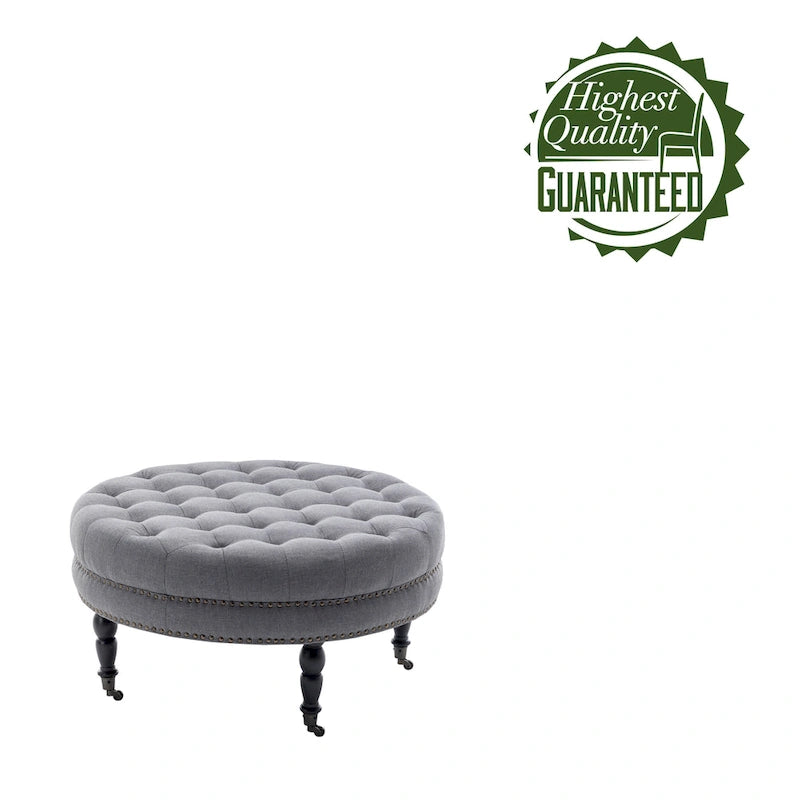 Pouf de cocktail rond en tissu Indy Porthos Home avec pieds et roulettes en bois d'hévéa