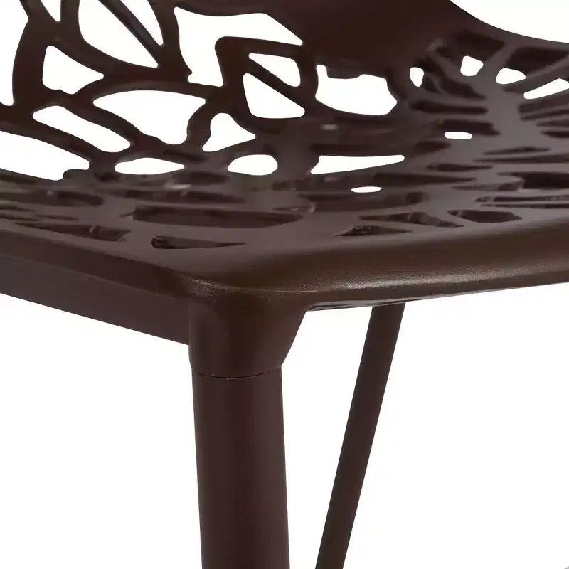 LeisureMod Devon Ensemble de salle à manger d'extérieur 5 pièces - Table ronde en verre avec 4 chaises empilables noires à motif floral
