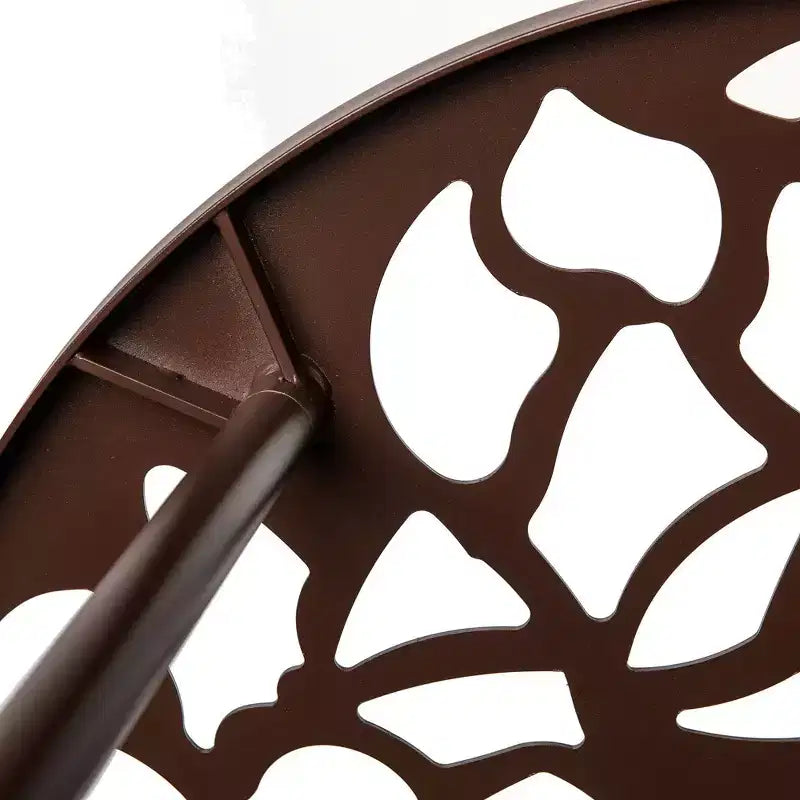 LeisureMod Devon Ensemble de salle à manger d'extérieur 5 pièces - Table ronde en verre avec 4 chaises empilables noires à motif floral