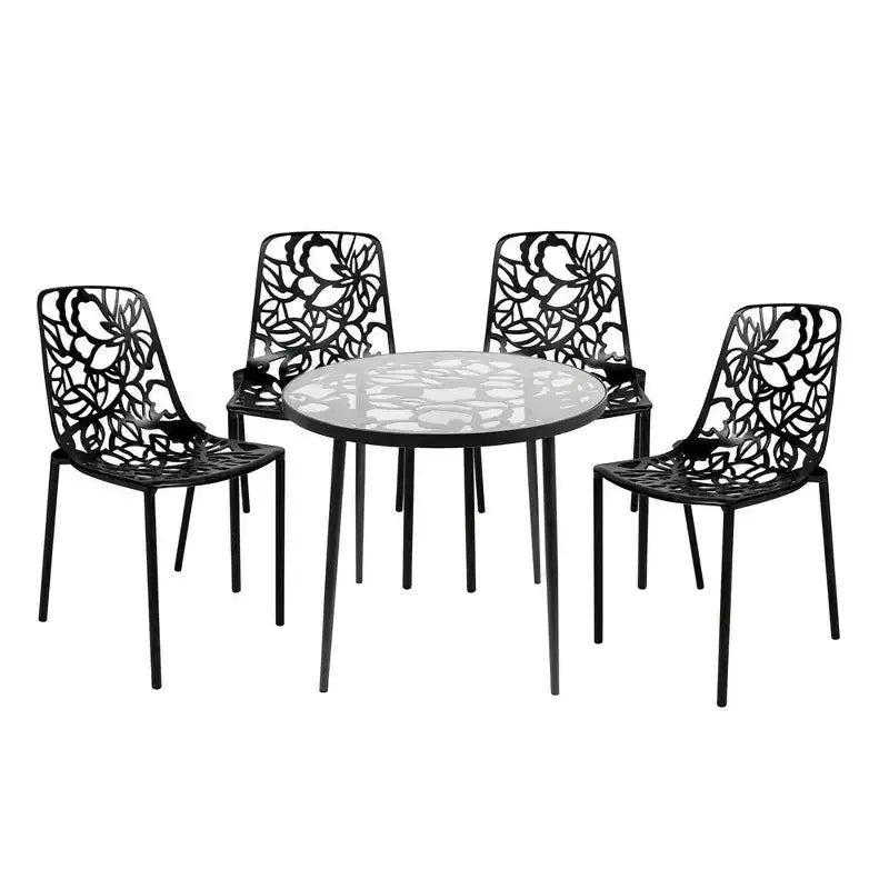 LeisureMod Devon 5-Piece Outdoor Dining Set - Round Glass Table with 4 Black Flower Design Stackable Chairs