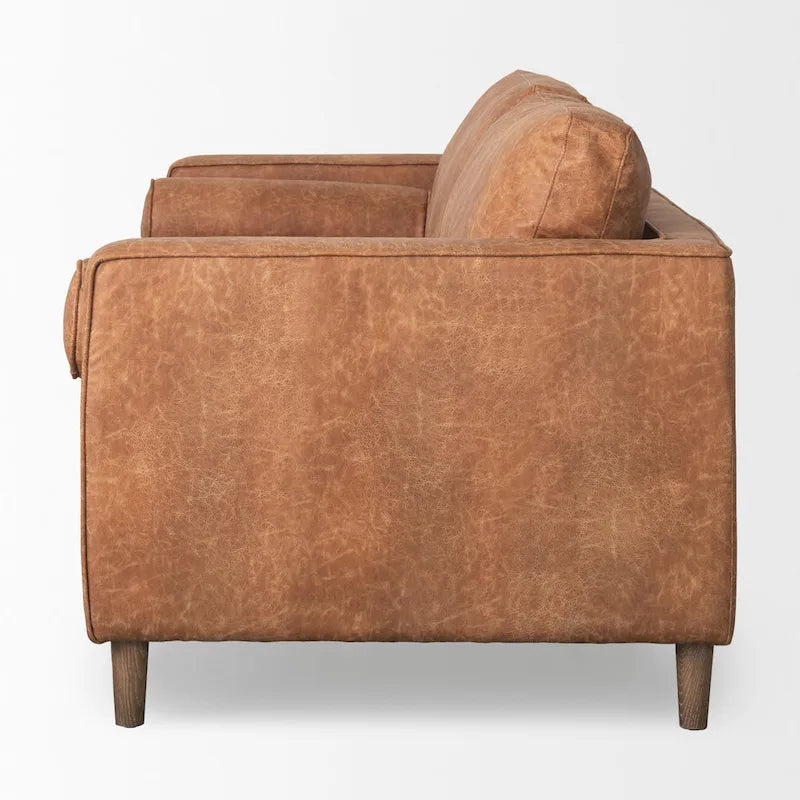 Canapé trois places Loretta en similicuir marron cognac avec traversins – 223,3 L x 91,9 P x 85,9 H
