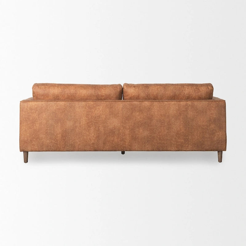 Canapé trois places Loretta en similicuir marron cognac avec traversins – 223,3 L x 91,9 P x 85,9 H