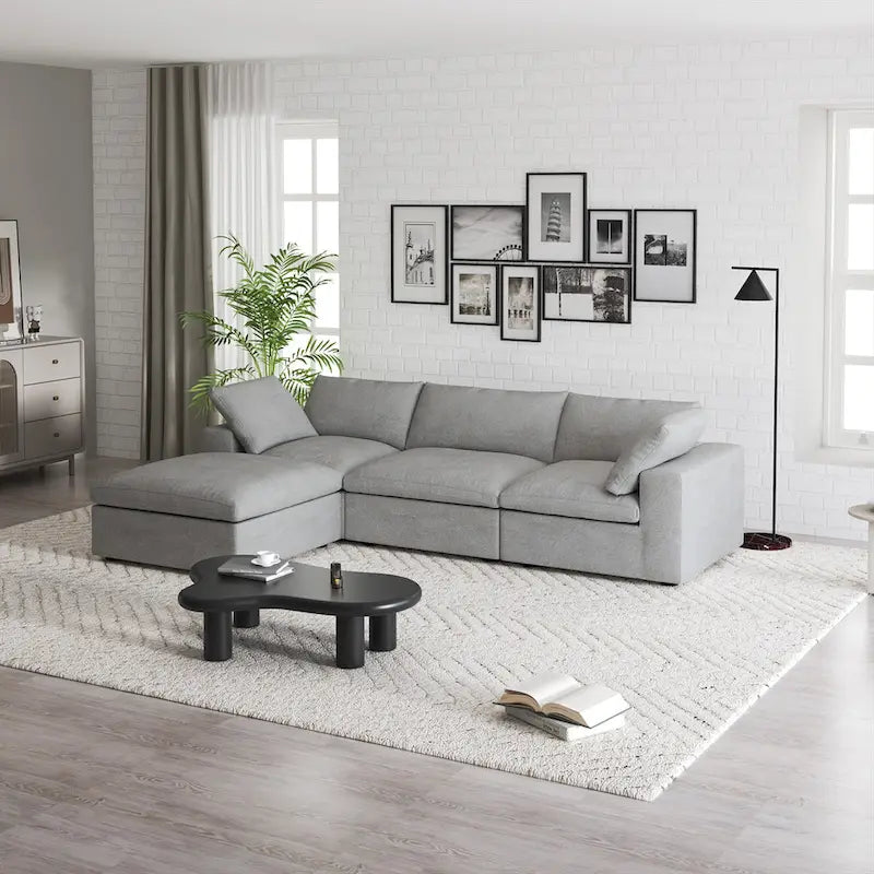 Canapé d'angle modulable 4 places en duvet Commix avec pouf de rangement