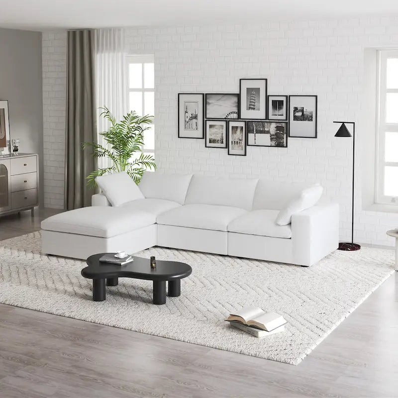 Canapé d'angle modulable 4 places en duvet Commix avec pouf de rangement
