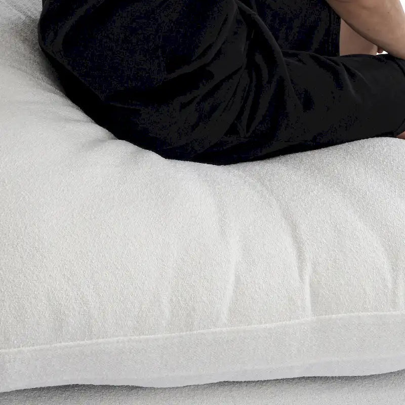 Canapé d'angle modulable 4 places en duvet Commix avec pouf de rangement