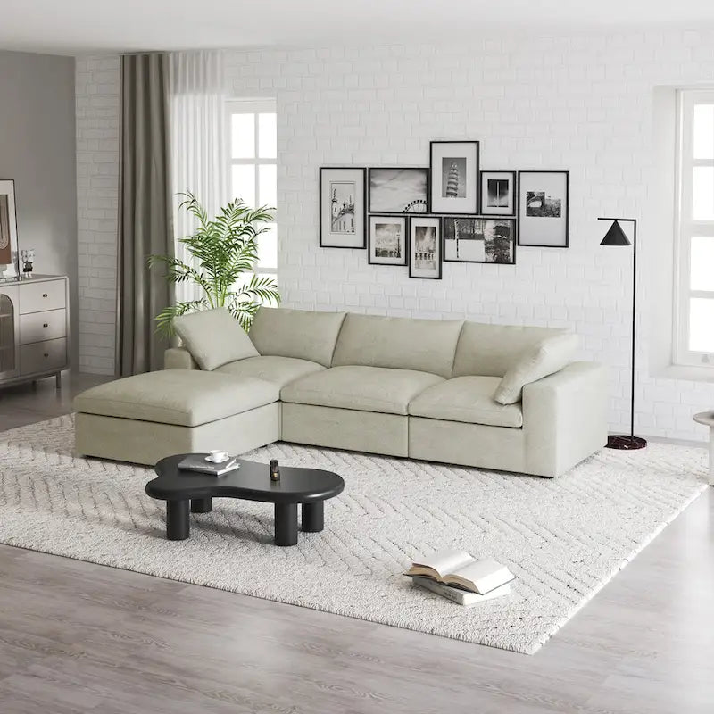 Canapé d'angle modulable 4 places en duvet Commix avec pouf de rangement