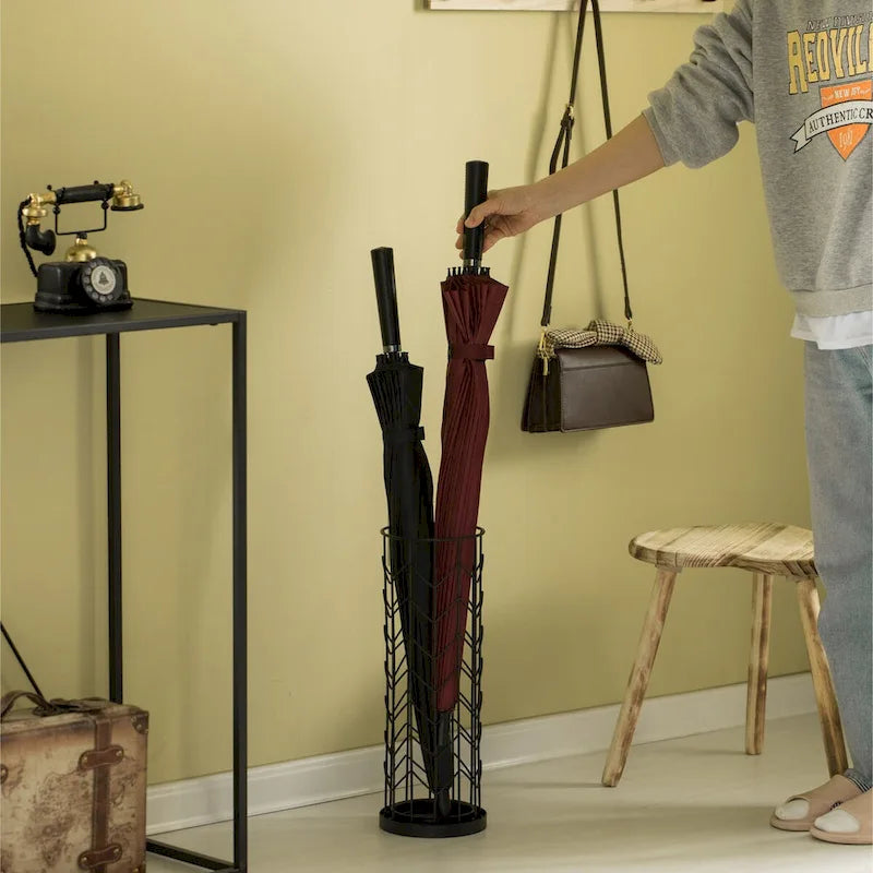 Porte-parapluie rond noir à design horizontal pour l'intérieur et l'extérieur avec bac de récupération d'eau