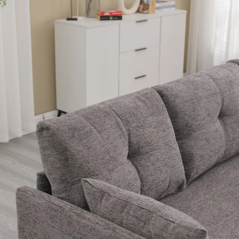 Le canapé en U peut être transformé en fauteuil inclinable avec fonction de rangement