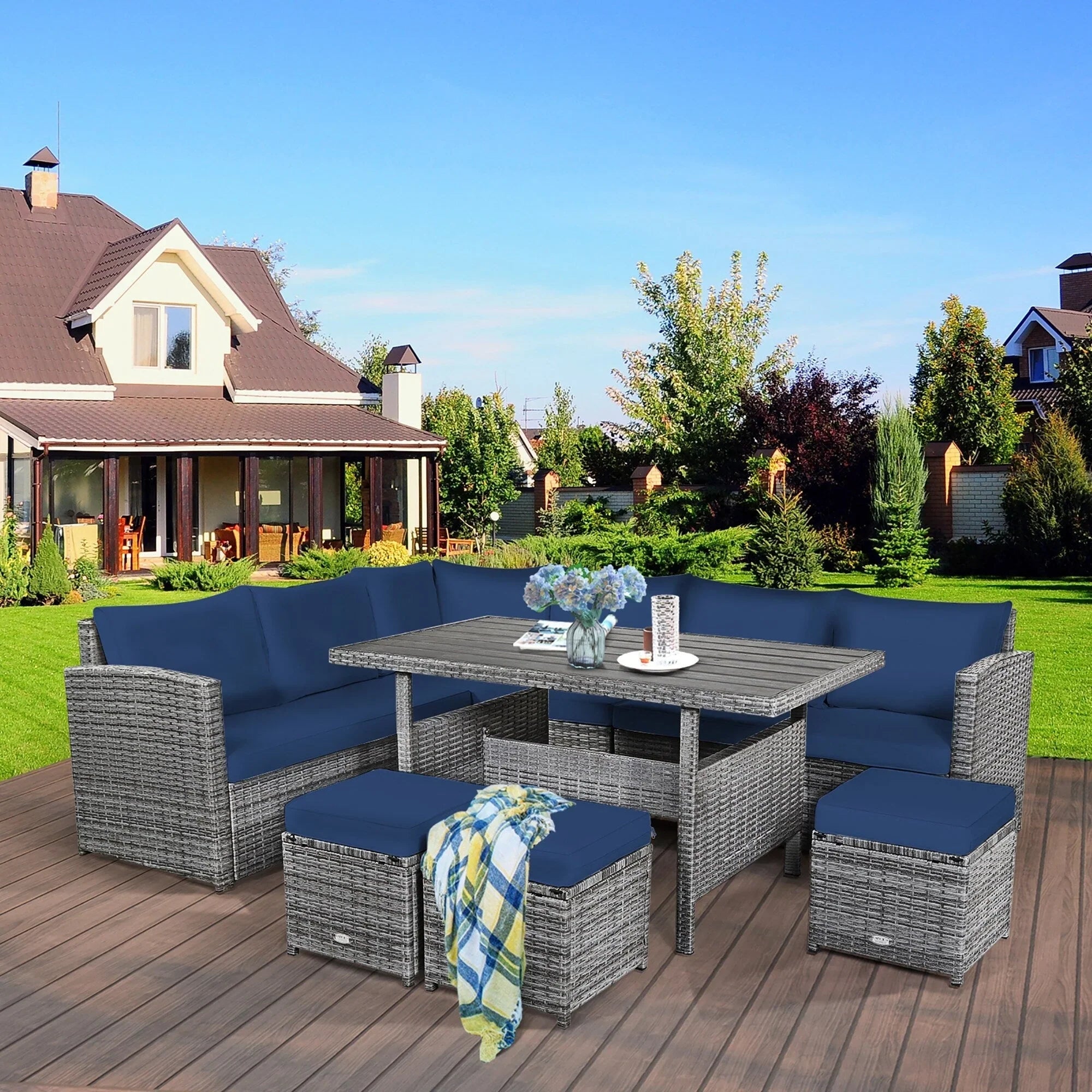 Ensemble de salle à manger Costway 7 pièces en rotin pour terrasse, canapé sectionnel et pouf - Voir détails